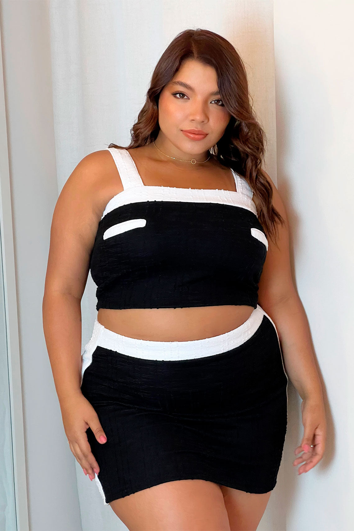 Set falda corta y top en tela tejida negro