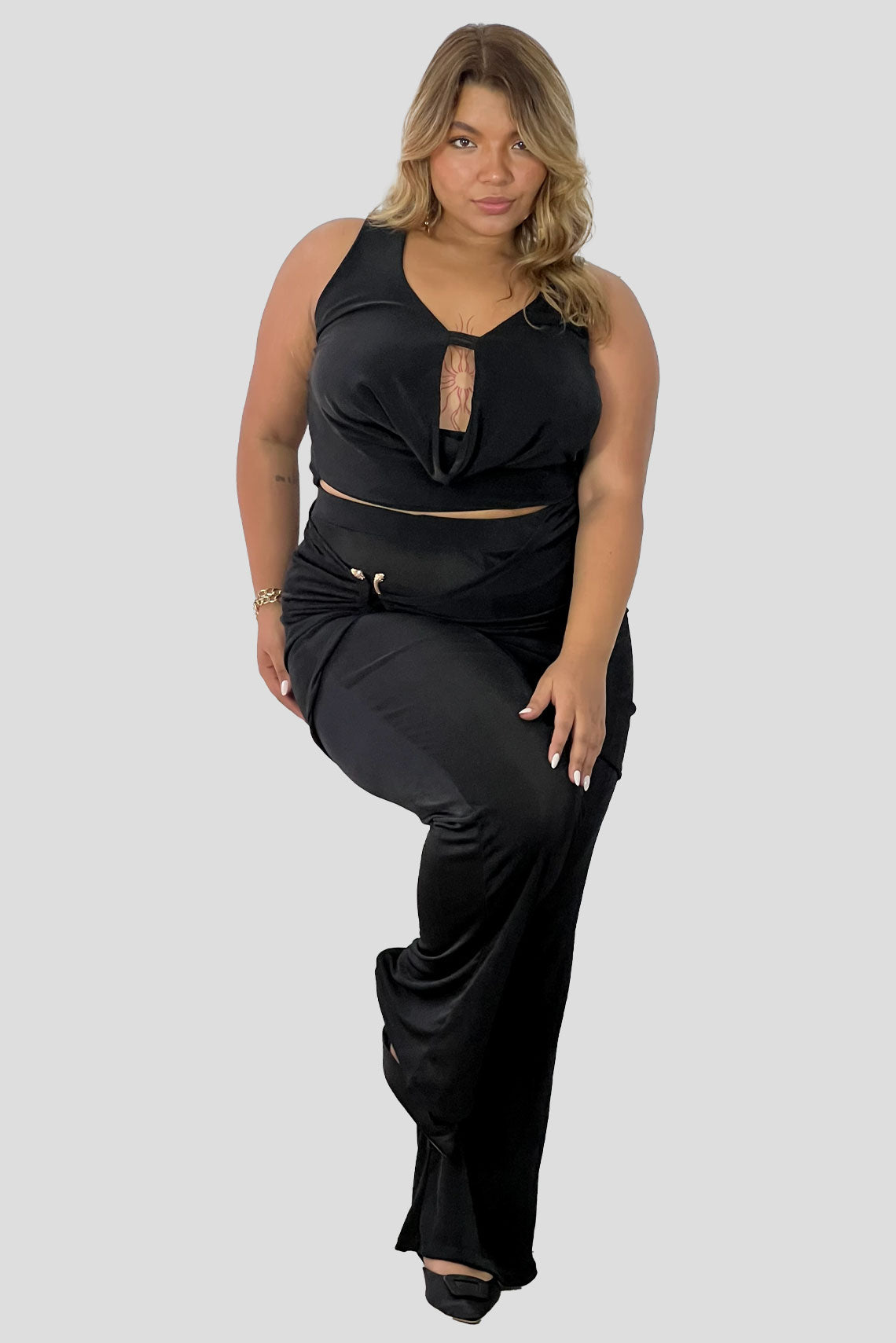 Set drapeado, pantalon y top Negro