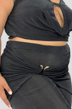 Set drapeado, pantalon y top Negro