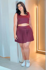 Set deportivo falda plisada vino